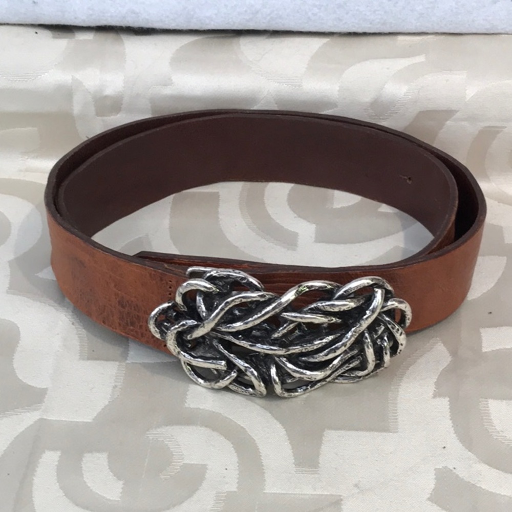Italian leather with ornate silver buckle belt